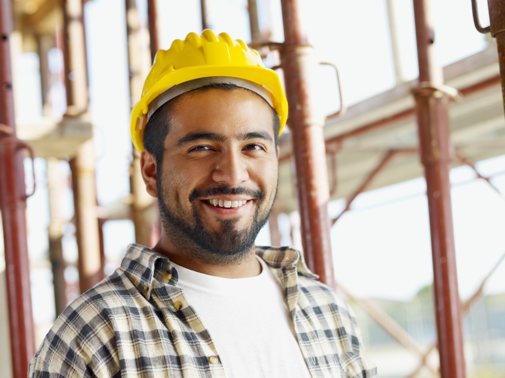 portrait of latin american construction worker, looking at camera